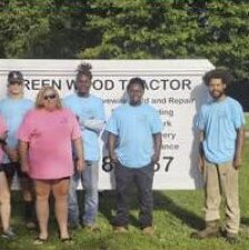The Green Wood Tractor crew outside the shop